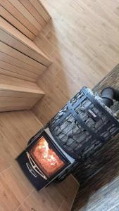 a book sitting on the floor next to a table at Lion Sauna in Vydmantai