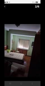 a small bedroom with a bed and a window at meadow in Ciudad Real