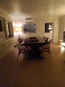 a dining room with a table and chairs at Skap Opplevelser in Svingvoll +18 photos