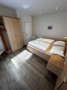 Postel nebo postele na pokoji v ubytování Strandhafer