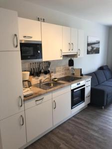 Kuchyň nebo kuchyňský kout v ubytování Westhook Ferienwohnung 1