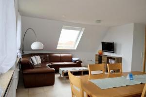 TV a/nebo společenská místnost v ubytování Stranddistel