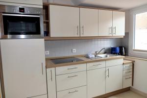 Kuchyň nebo kuchyňský kout v ubytování Stranddistel + 10 fotografií