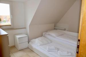 Postel nebo postele na pokoji v ubytování Stranddistel