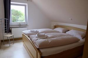 Postel nebo postele na pokoji v ubytování Meeresgruß