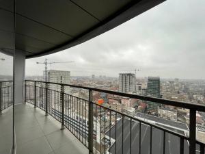 a balcony with a view of a city at Мост сити АПП 151 с терассой in Dnipro