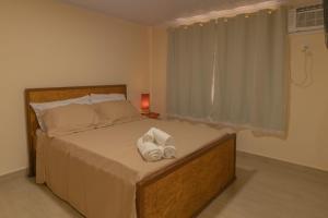 Postel nebo postele na pokoji v ubytování recanto mineiro