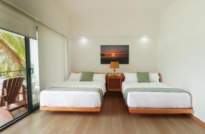 Postel nebo postele na pokoji v ubytování Acuaski