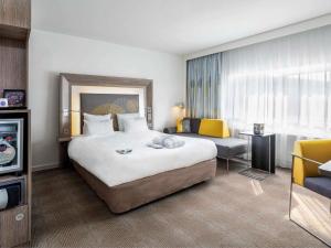 Postel nebo postele na pokoji v ubytování Novotel The Hague World Forum