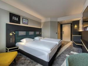 Postel nebo postele na pokoji v ubytování Mercure Neu-Isenburg + 98 fotografií