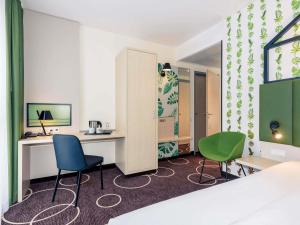 Postel nebo postele na pokoji v ubytování Mercure Hotel Hannover Mitte