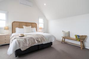 Ένα ή περισσότερα κρεβάτια σε δωμάτιο στο Hamptons Haven