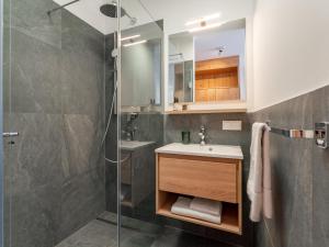 a bathroom with a sink and a shower at Grebenzen Lodge Edelweiss in Sankt Lambrecht +92 photos