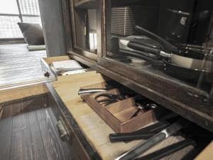 a kitchen counter with a drawer full of tools at 旅館 なおみ in Toba +21 photos