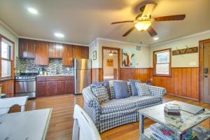 a living room with a couch and a table at Lakefront Eucha Escape with Views and Boat Slip! in Eucha