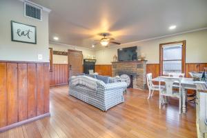 a living room with a couch and a table at Lakefront Eucha Escape with Views and Boat Slip! in Eucha