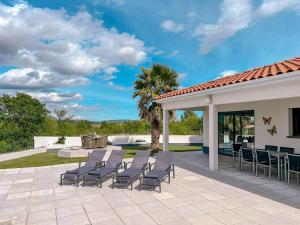 a patio with chairs and a table on a patio at Panorama in Rieux-Minervois