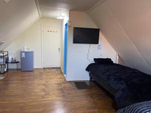 TV a/nebo společenská místnost v ubytování Alojamiento 2 Oriente