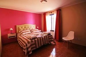 En eller flere senge i et værelse på Susy Rental