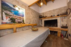 a living room with a table and a fireplace at Apartments by the sea Igrane, Makarska - 311 in Igrane