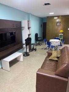 TV/trung tâm giải trí tại Quarto Confortável