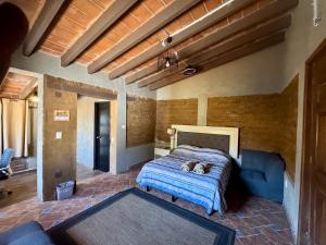 Ένα ή περισσότερα κρεβάτια σε δωμάτιο στο Cabañita TEPOZTLÁN