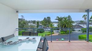 a snake sitting on a table on a balcony at The Point On Cliff - Two Levels and Views in Avoca Beach
