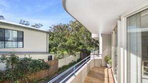 a balcony with a view of a house at Sandpiper 4 - Great Location in Avoca Beach