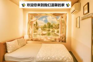 a bedroom with a painting on the wall at Nam Mỹ Vân Homestay - ĐH Công nghiệp Thái Nguyên in Thái Nguyên