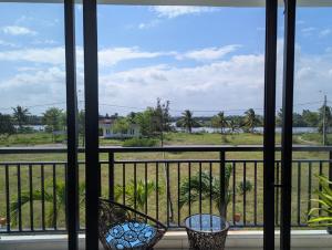 a view from a balcony with a view of a street at EasyLife Villa Hội An in Tân Thành (1) +11 photos