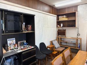 a room with a table and chairs and a desk and a dining room at hamanocho Ap in Shimminatomachi +21 photos
