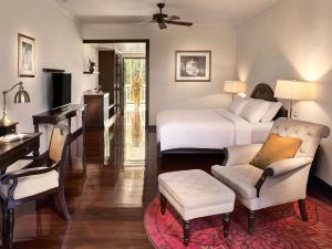 a bedroom with a bed and a desk and a couch at Sofitel Krabi Phokeethra Golf and Spa Resort in Klong Muang Beach +228 photos