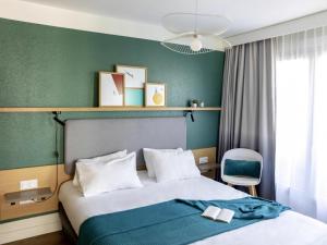 Postel nebo postele na pokoji v ubytování Aparthotel Adagio Annecy Centre