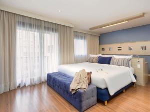 Un pat sau paturi într-o cameră la Mercure Sao Paulo Pamplona +89 fotografii