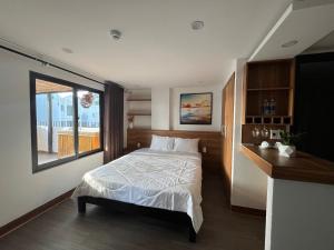 Ένα ή περισσότερα κρεβάτια σε δωμάτιο στο SAM Hotel and Apartment