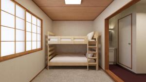 Ένα ή περισσότερα κρεβάτια σε δωμάτιο στο The GAKUSUI