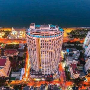 a large building in the middle of a city at Panorama Win Residences Nha Trang in Nha Trang