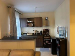 a small kitchen with a couch and a counter top at Frost Homes in Eldoret
