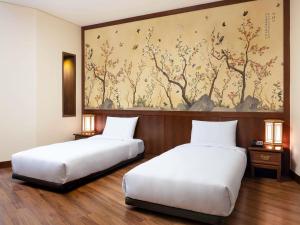 Ένα ή περισσότερα κρεβάτια σε δωμάτιο στο Ibis Ambassador Myeongdong +73 φωτογραφίες