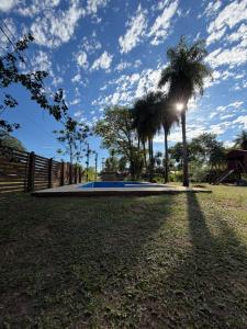 a skate park with palm trees and a fence at ElCapullo - Paso de la Patria in Paso de la Patria