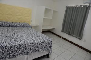 Ένα ή περισσότερα κρεβάτια σε δωμάτιο στο Pousada gransouza