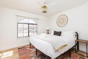 a white bedroom with a bed and a ceiling fan at Western Hills-Heated Pool-In Fountain Hills in Fountain Hills +56 photos