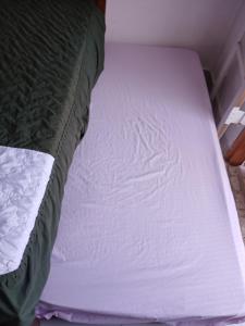 Ένα ή περισσότερα κρεβάτια σε δωμάτιο στο Cantinho da Praia