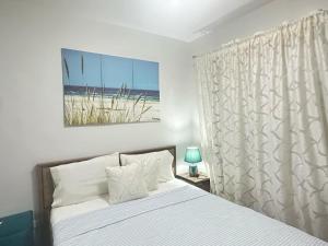 Ένα ή περισσότερα κρεβάτια σε δωμάτιο στο Tagaytay Idyllic Unwind Spot Retreat Near Foodie Area