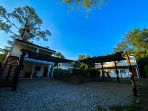 a playground in front of a building at Cabañas El Nogal in Villa Anizacate