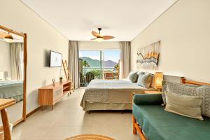 TV a/nebo společenská místnost v ubytování Hotel Velas do Engenho