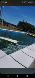 Swimmingpoolen hos eller tæt på Cabaña Paraíso Rural