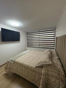 Voodi või voodid majutusasutuse Departamento Totalmente Equipado toas