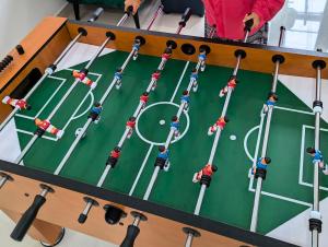 an overhead view of a table with a soccer game at EasyLife Villa Hội An in Tân Thành (1)