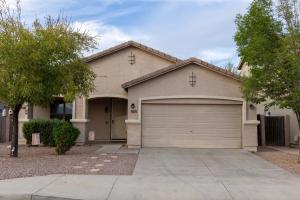 a house with a garage and a driveway at The Margarita in Phoenix